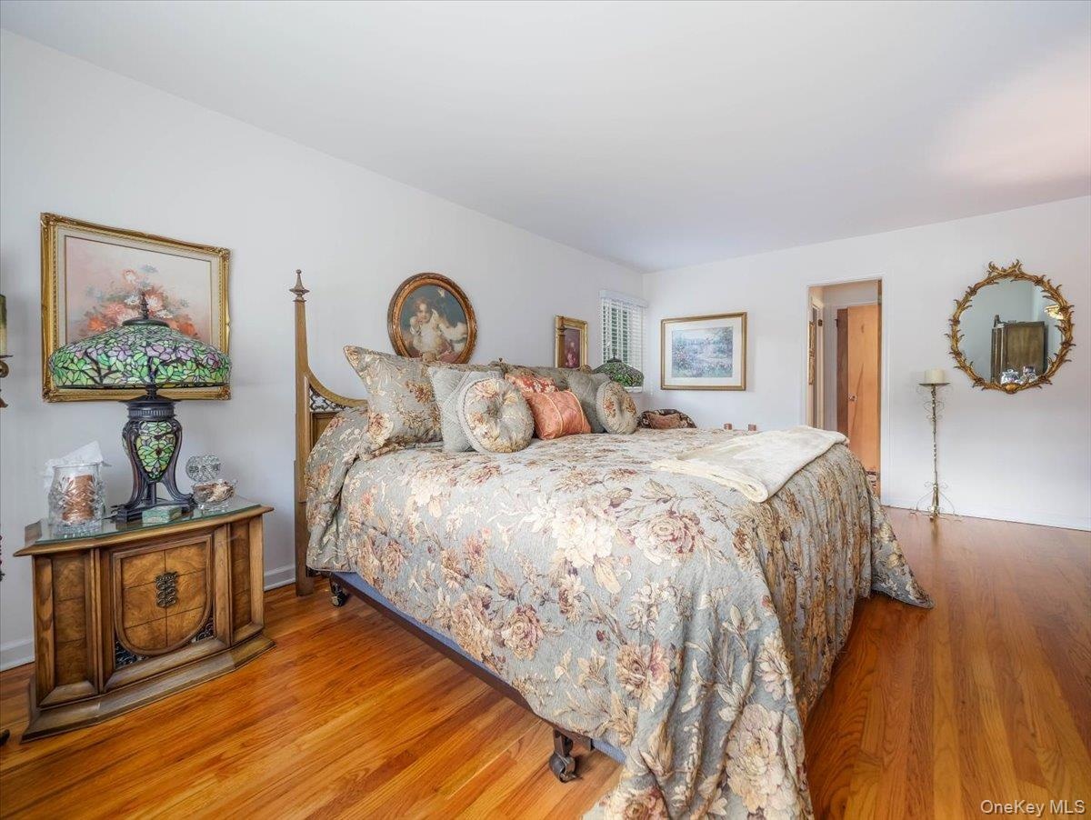 Hardwood floors, walk in closet and primary bathroom