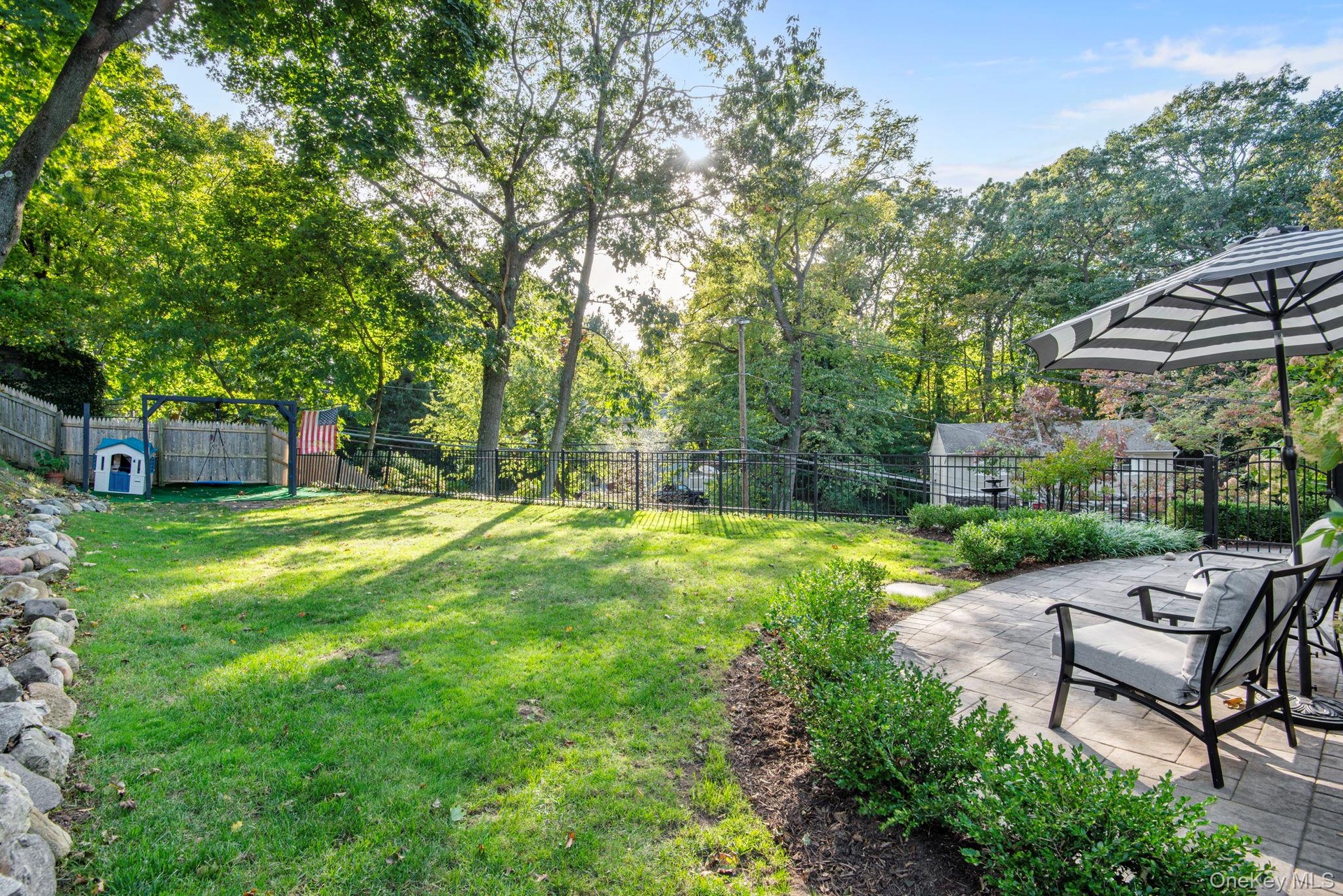 Beautiful flat yard, private and high above the street.