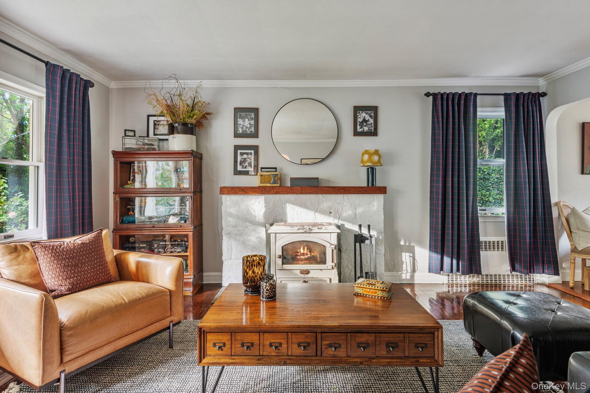 Cozy living room with wood burning stove and views to the porch.