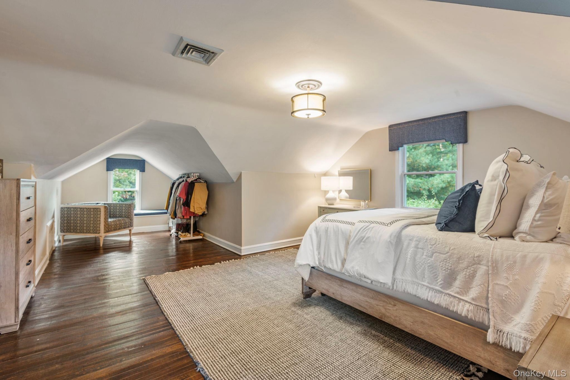 Primary bedroom with extra room for seating area or storage. Plus a window seat!