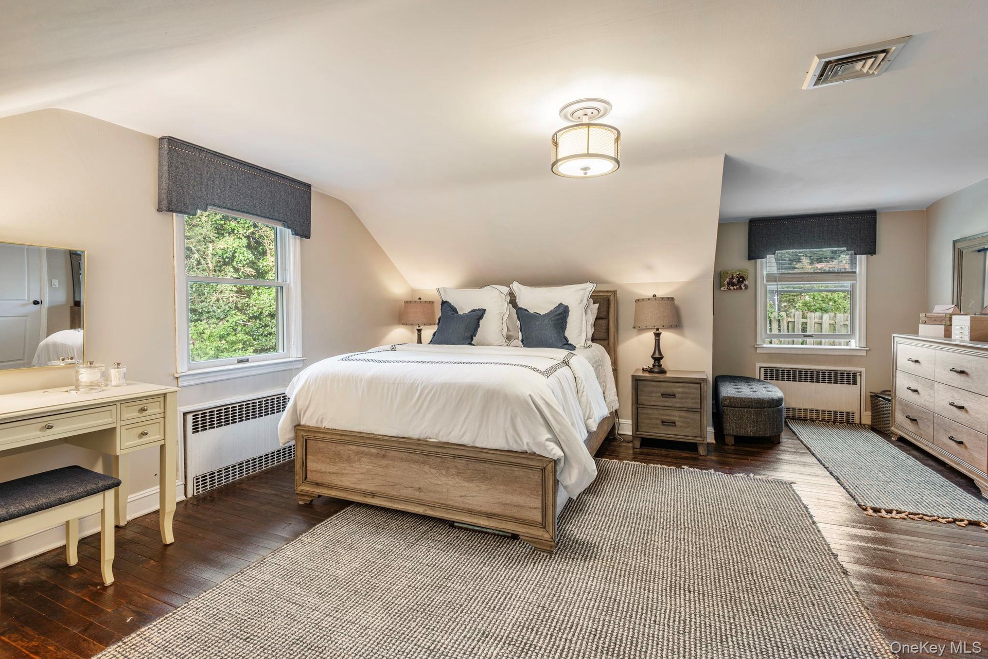 Large primary bedroom with extra space.