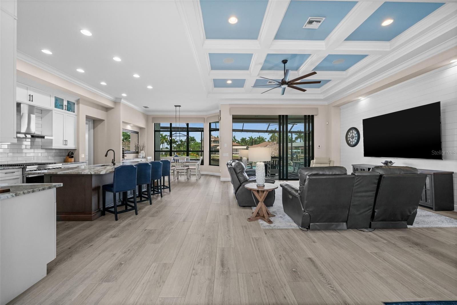 Tray ceilings and tile floors in the open concept living area