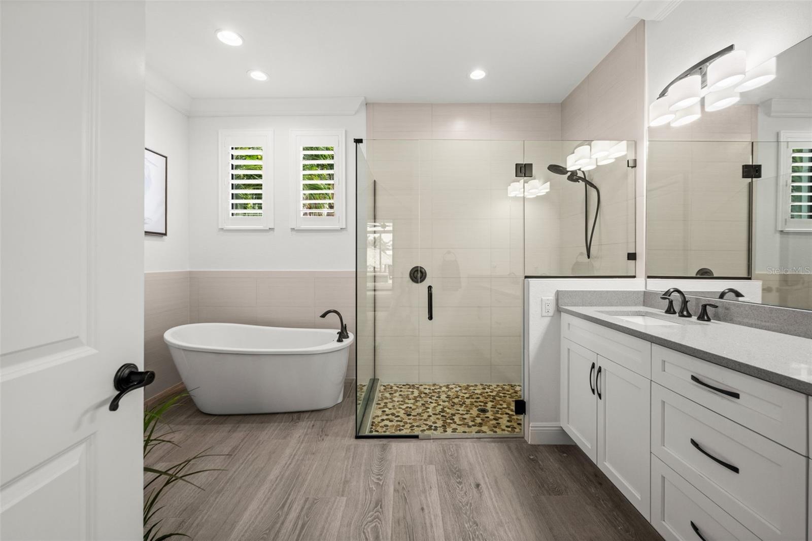 Walk in shower and separate bath in the Primary