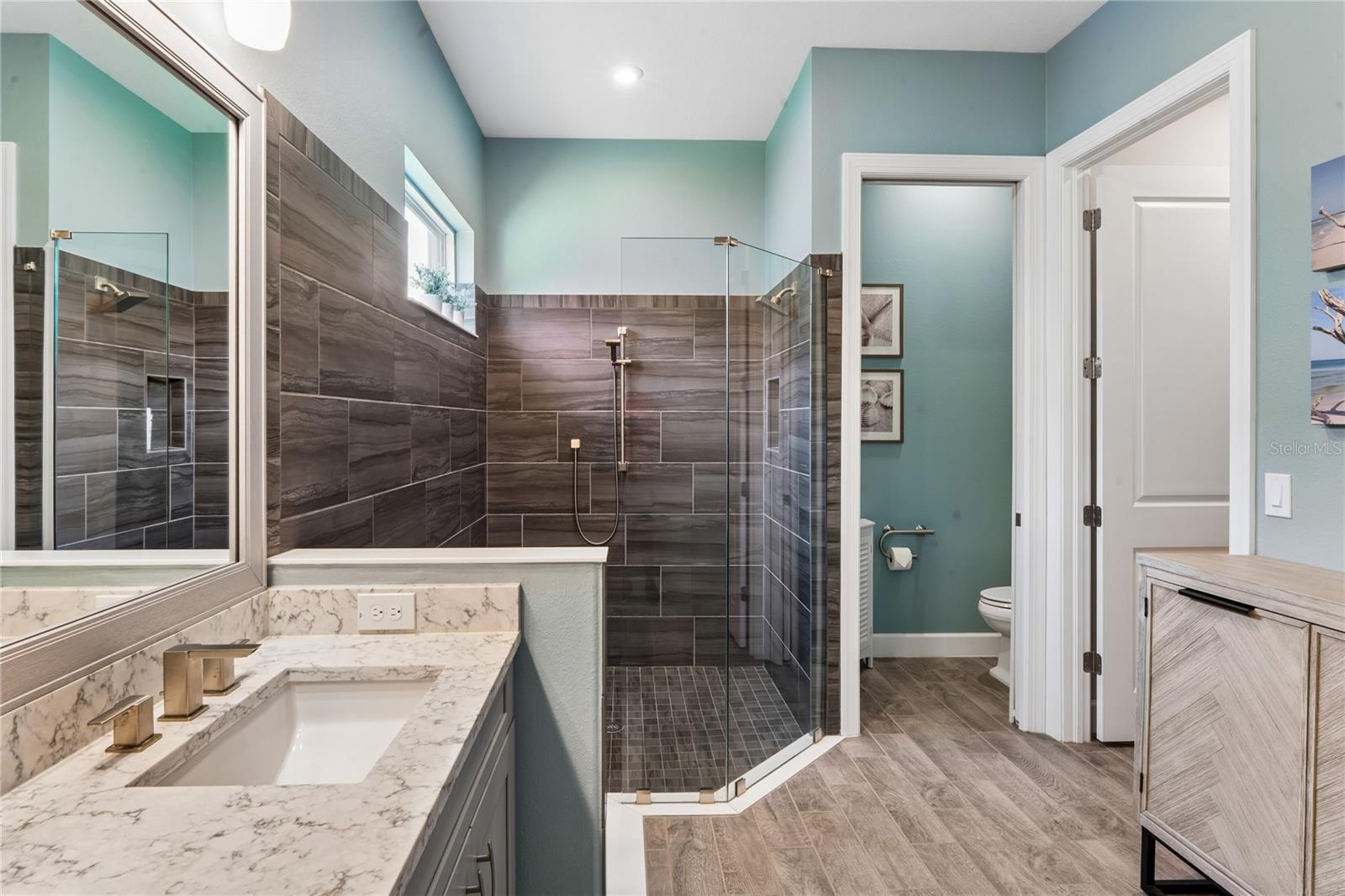 Primary bathroom w/ water room & walk-in closet