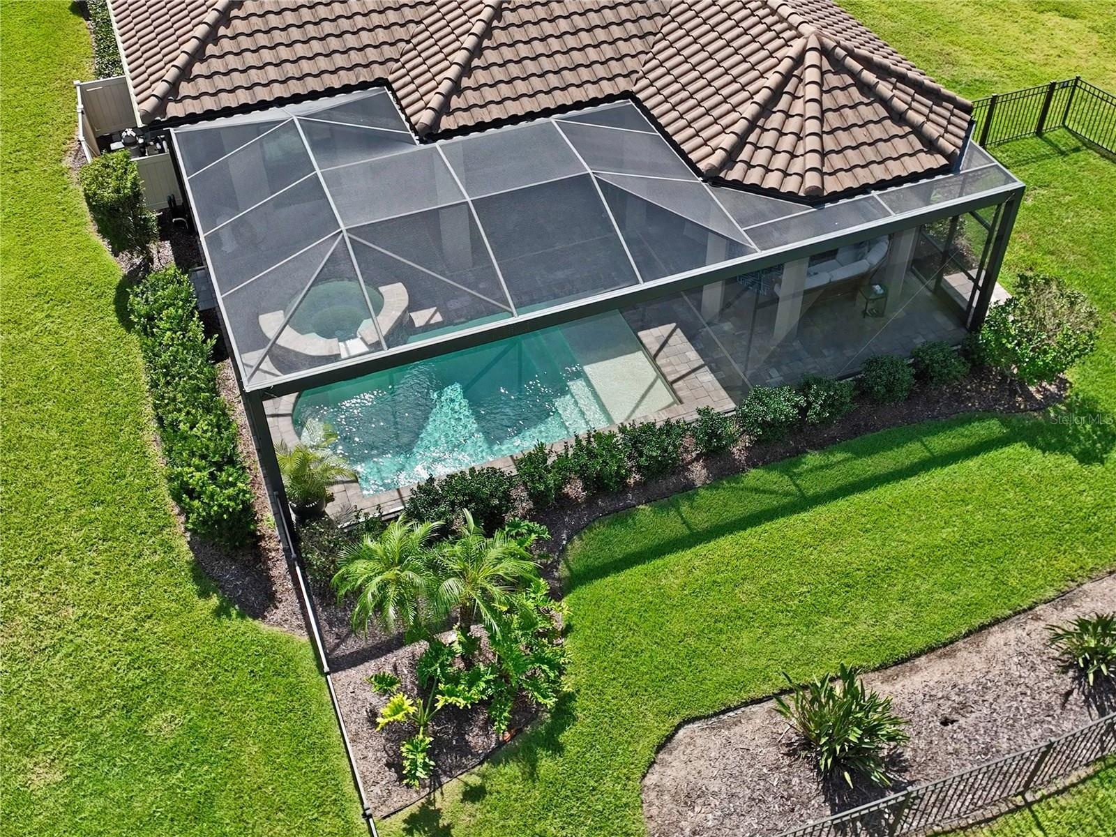 Drone view of backyard, Saltwater Pool & Spa w/ screen enclosure