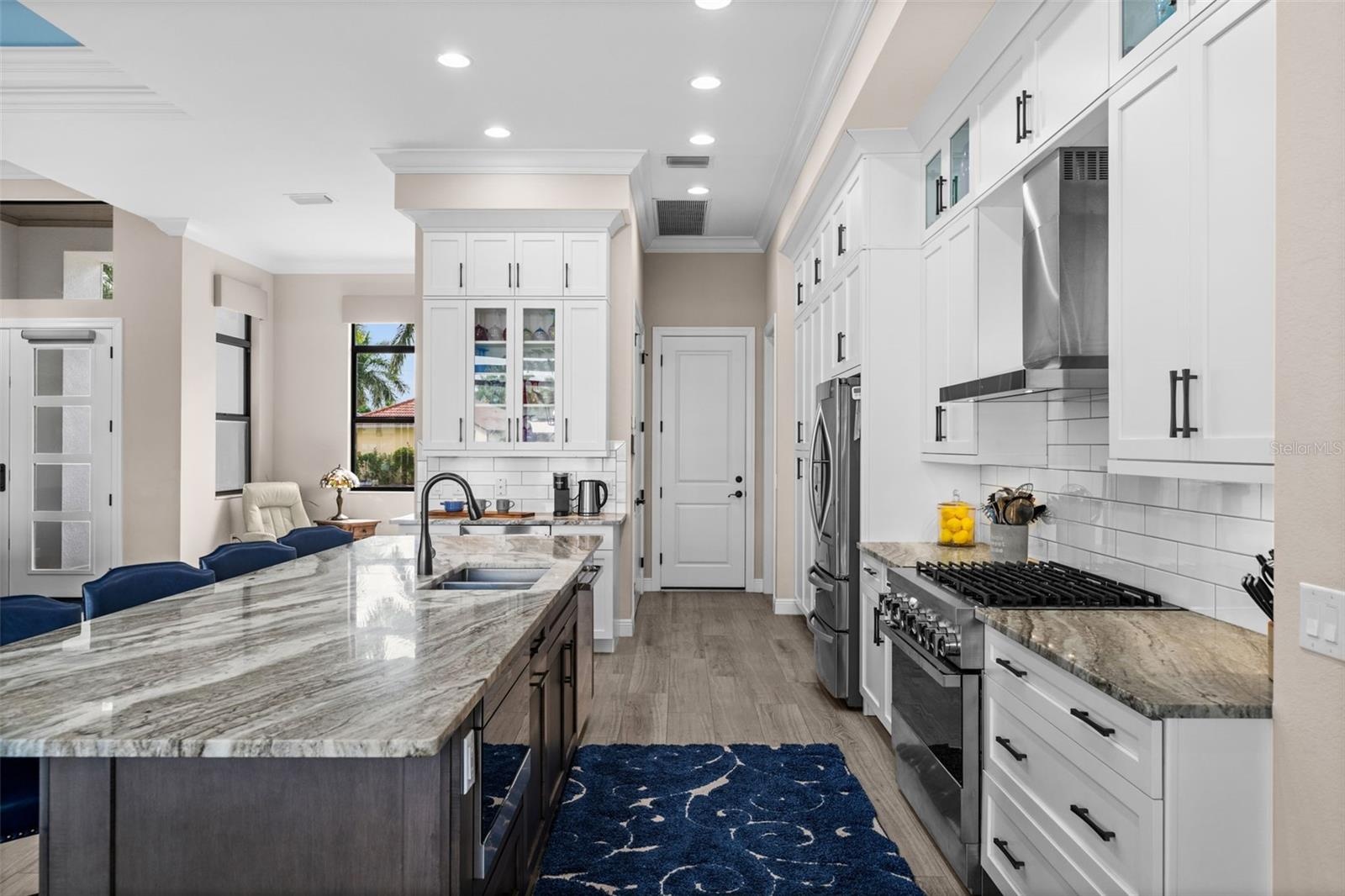 Granite tops and lots of cabinets in this well planned kitchen
