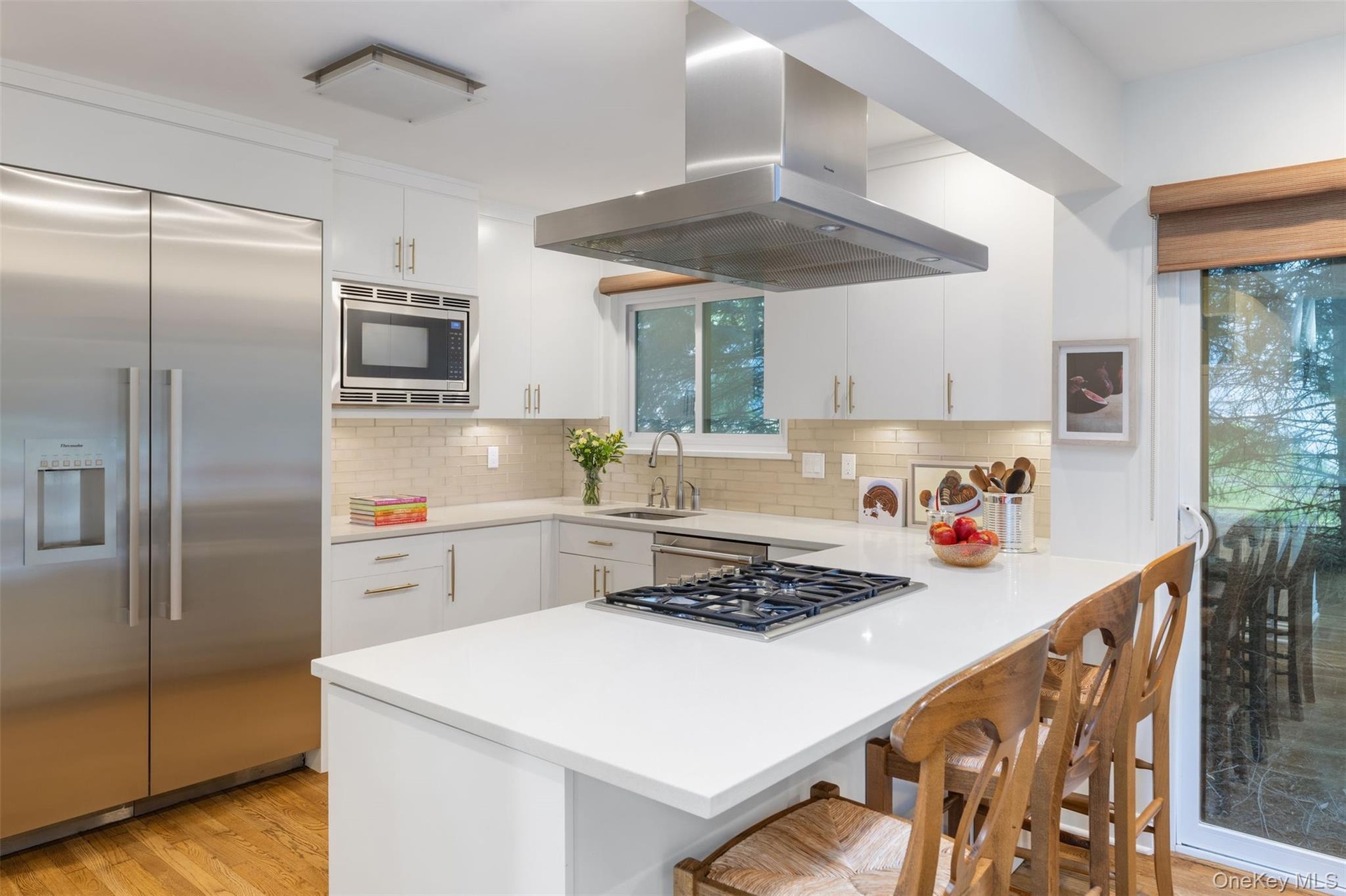 Chefs kitchen with stainless appliances and lots of storage space.