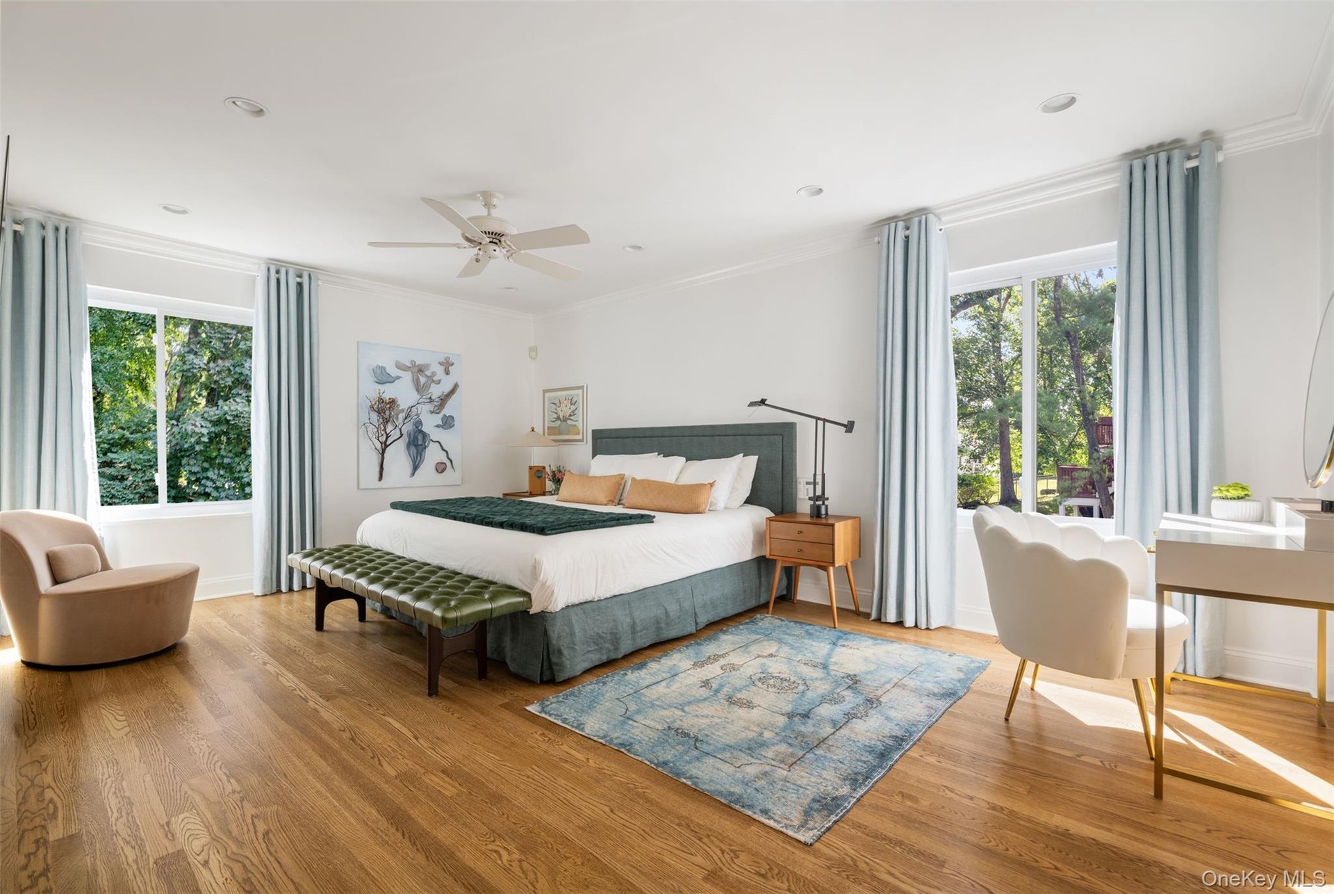 Serenely beautiful primary bedroom suite.