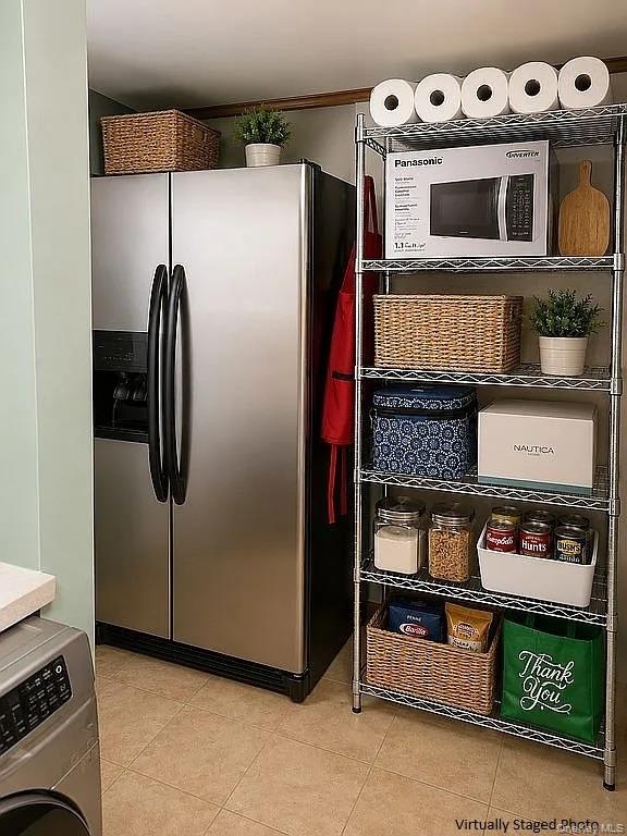 Stainless steel side-by-side refrigerator with exterior ice and water dispenser