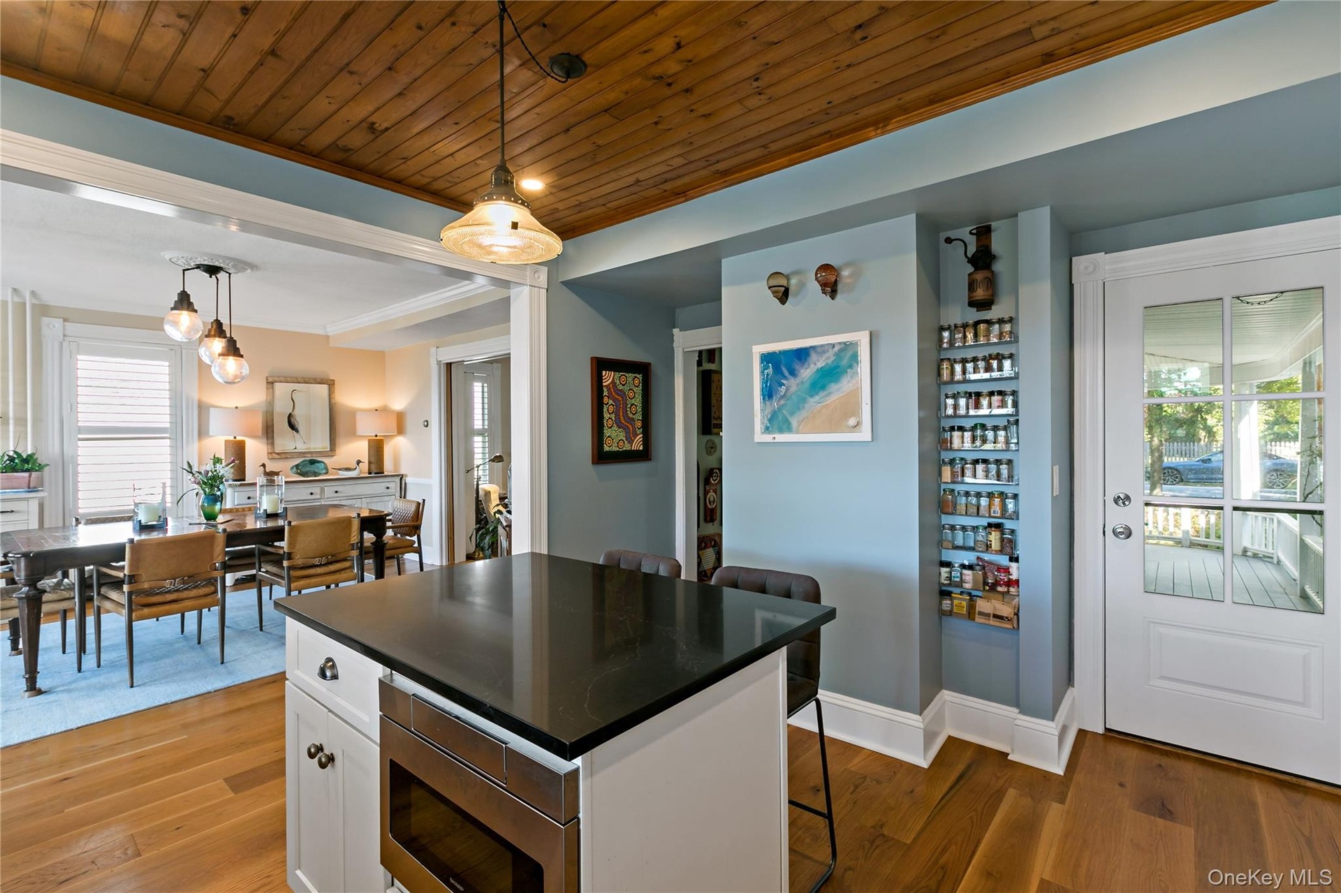 This angle of the kitchen shows the side door to front porch.