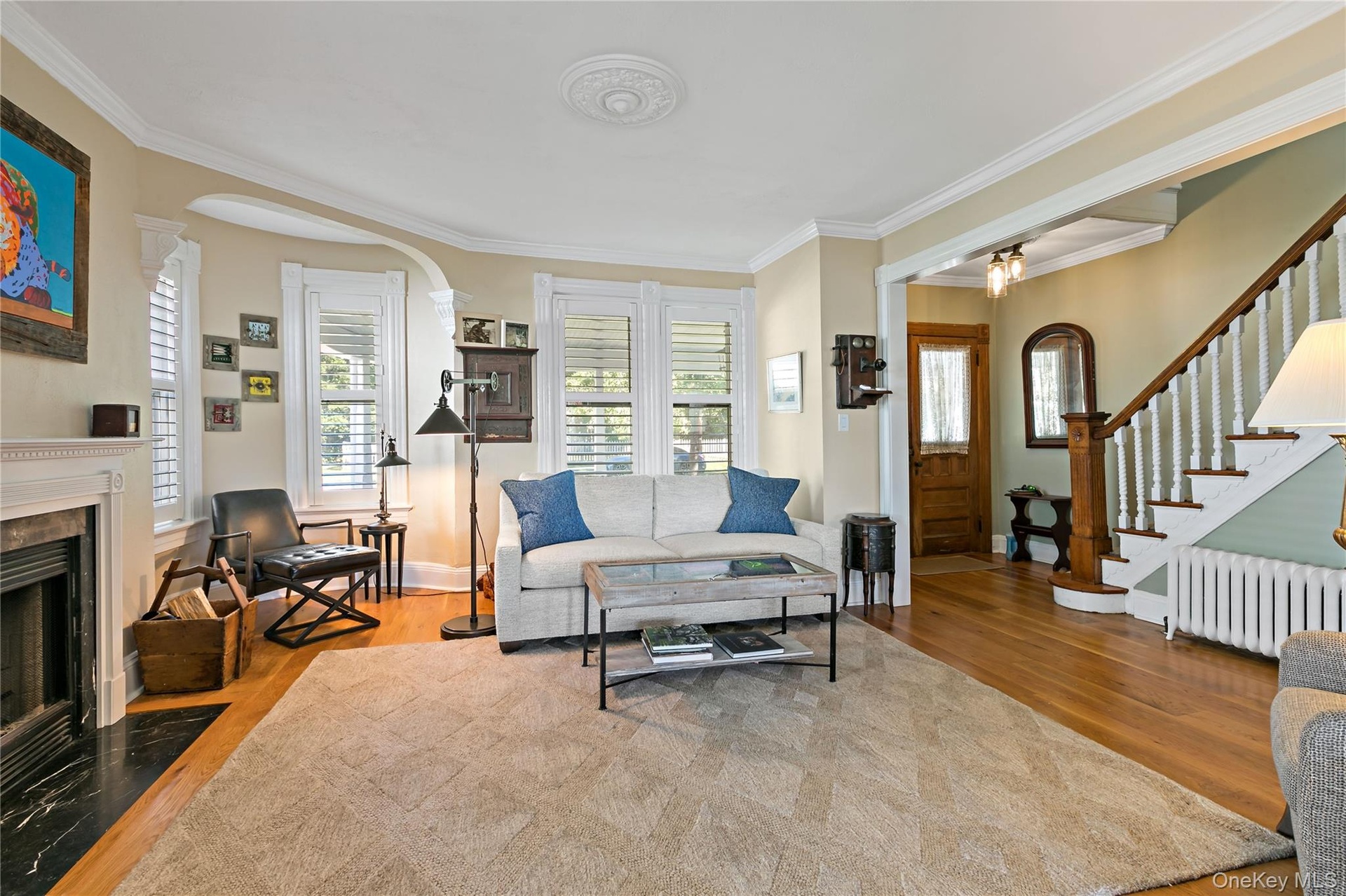 Intimate turret reading nook in the living room. Double door front entry way.