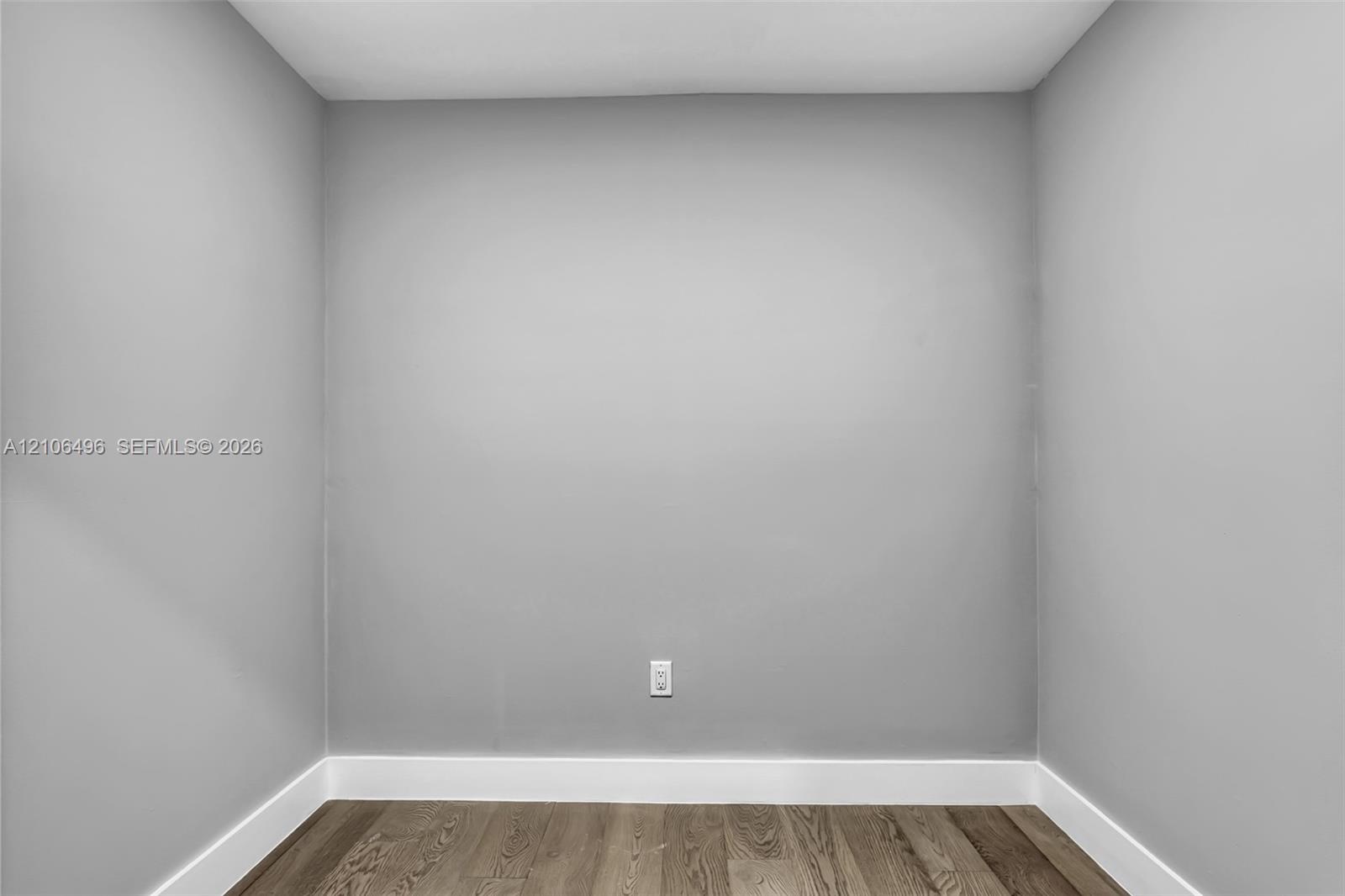 Neutral-toned walls and wood-finish flooring
