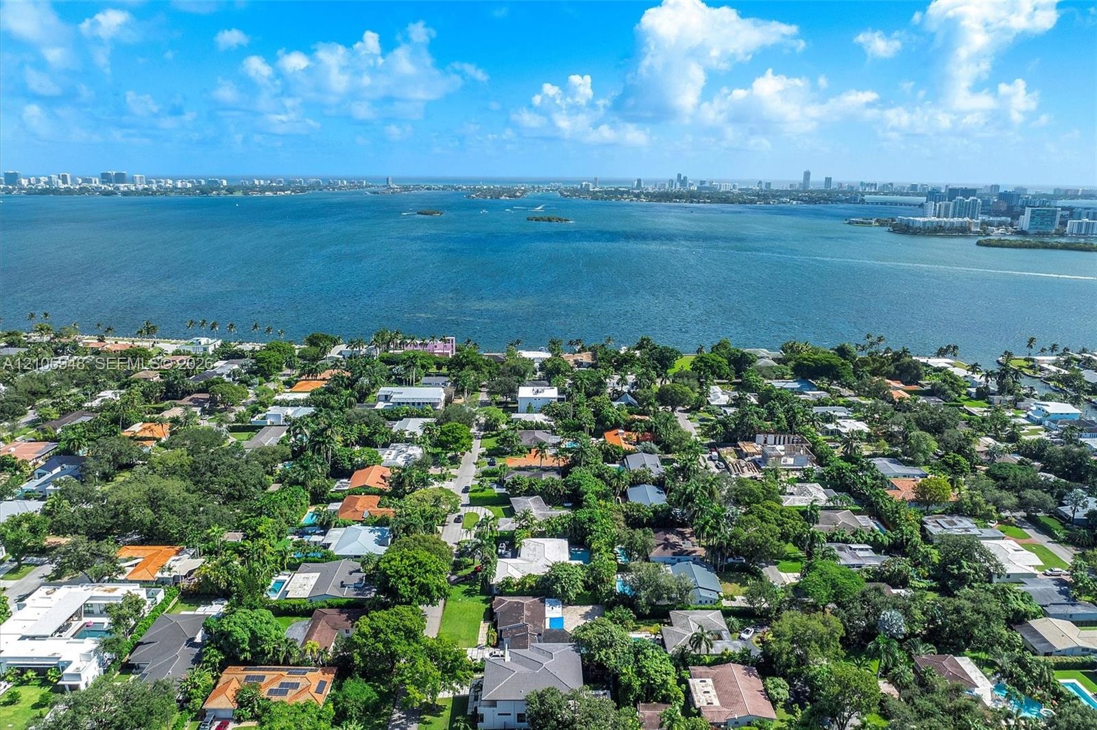 Aerial perspective featuring proximity to the waterfront and expansive maritime surroundings