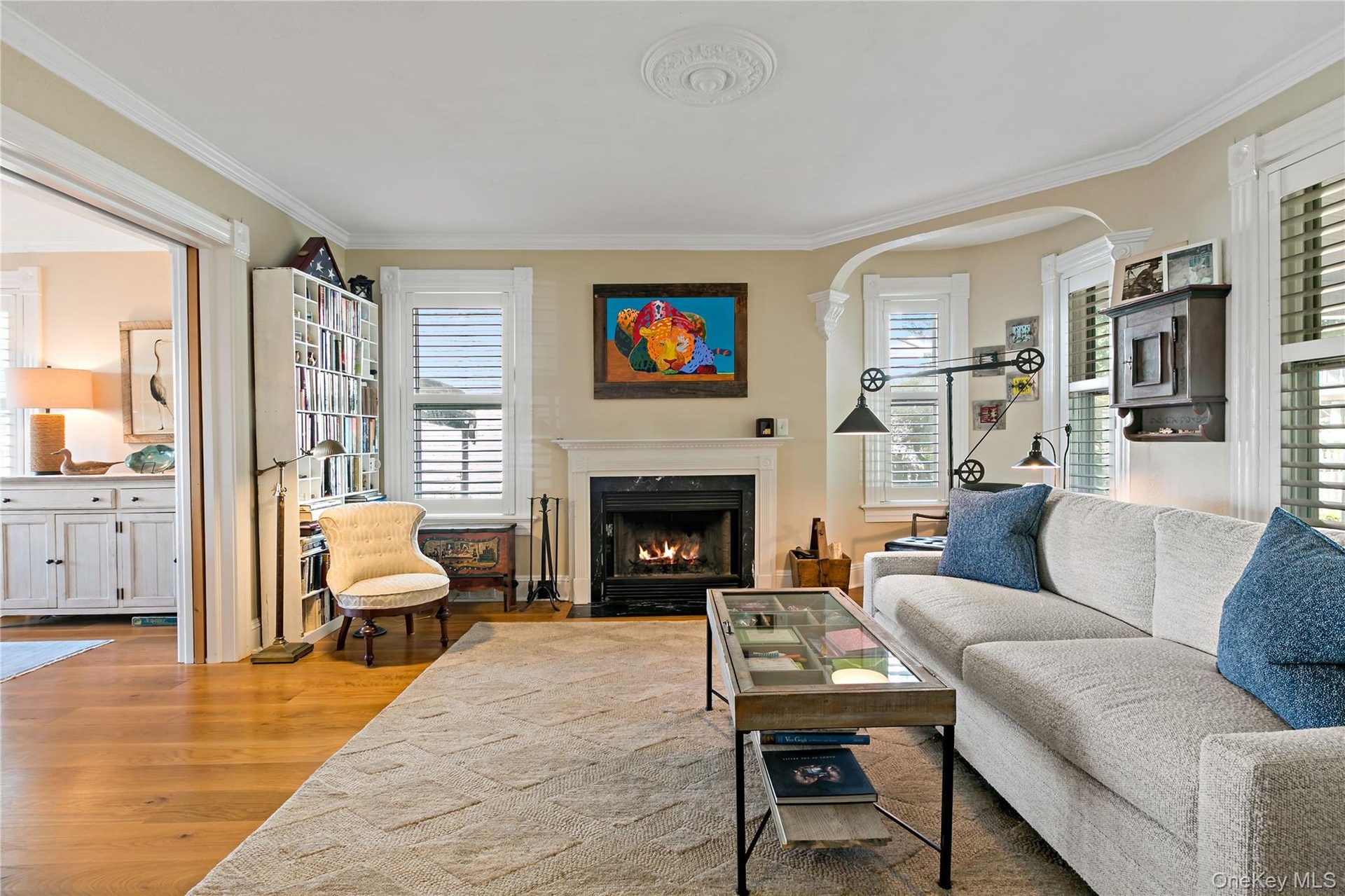 Formal living room with wood burning fireplace.