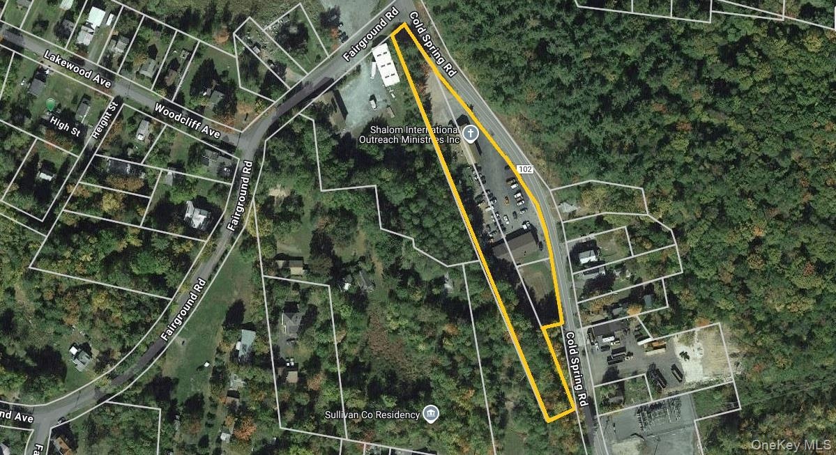 Aerial view of property's location featuring property parcel outlined