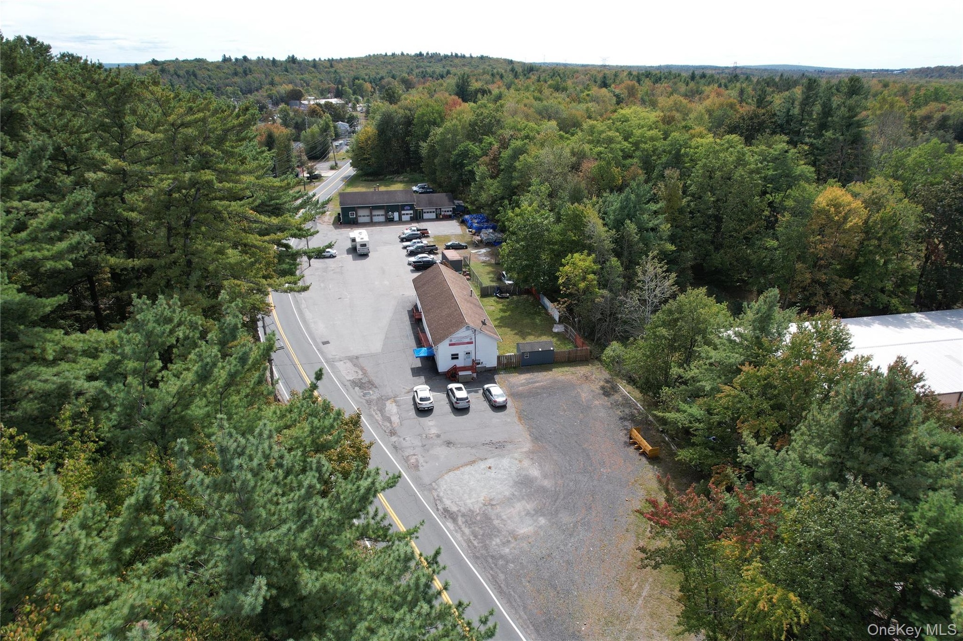View of property location with a forest