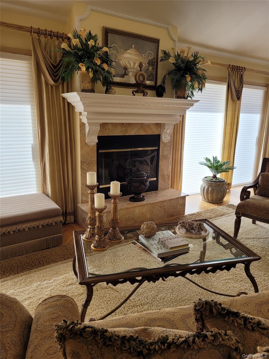 Decorative fireplace with a carved mantel and stone surround