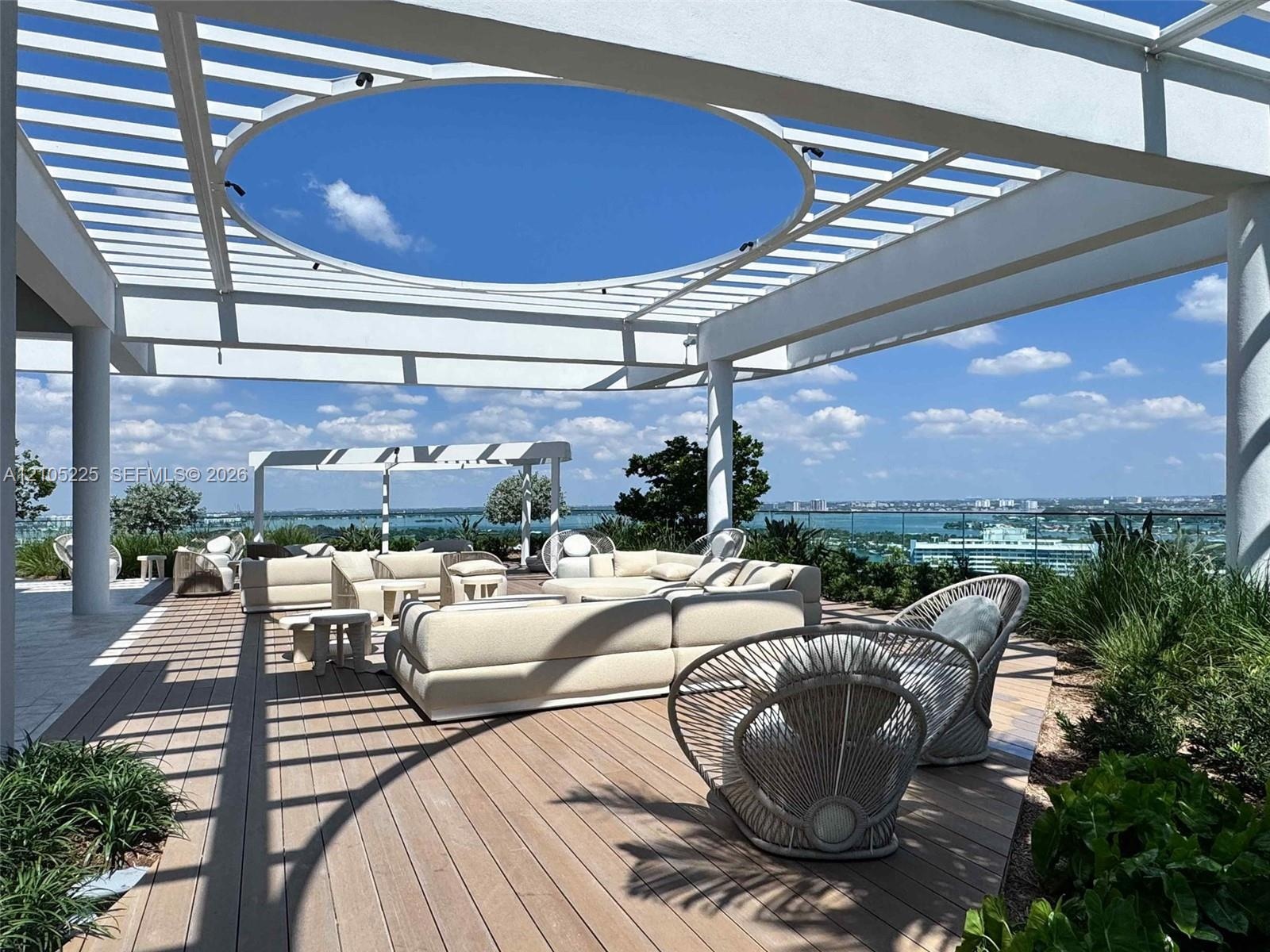 Expansive outdoor deck featuring wood-finish flooring
